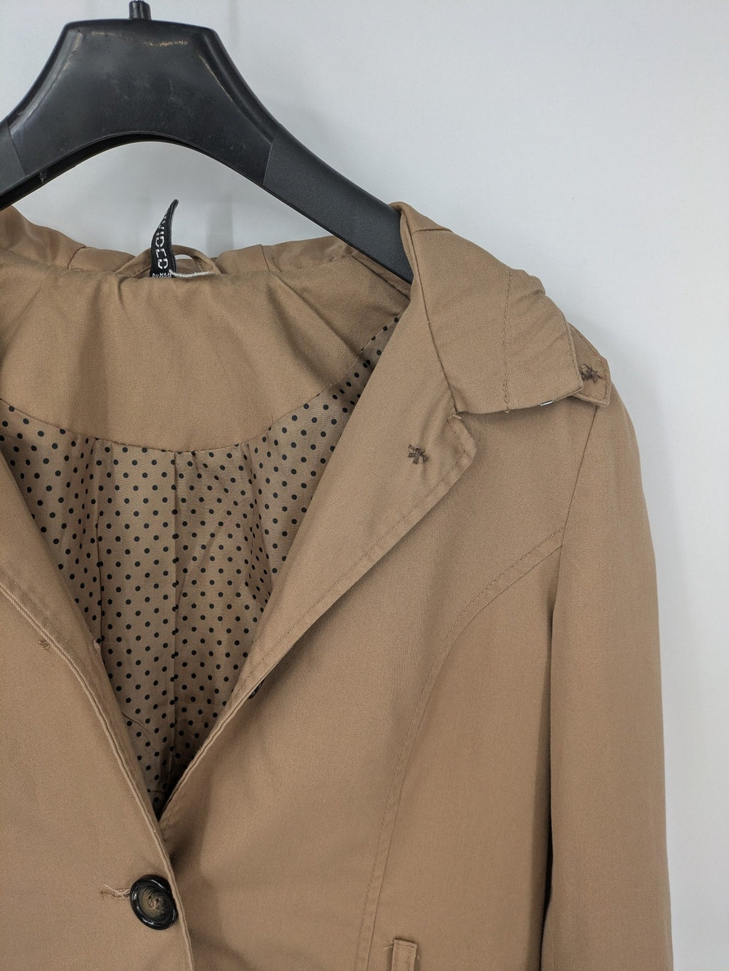 H&M Divided beige trench coat with button closure, hood, and polka dot lining.
