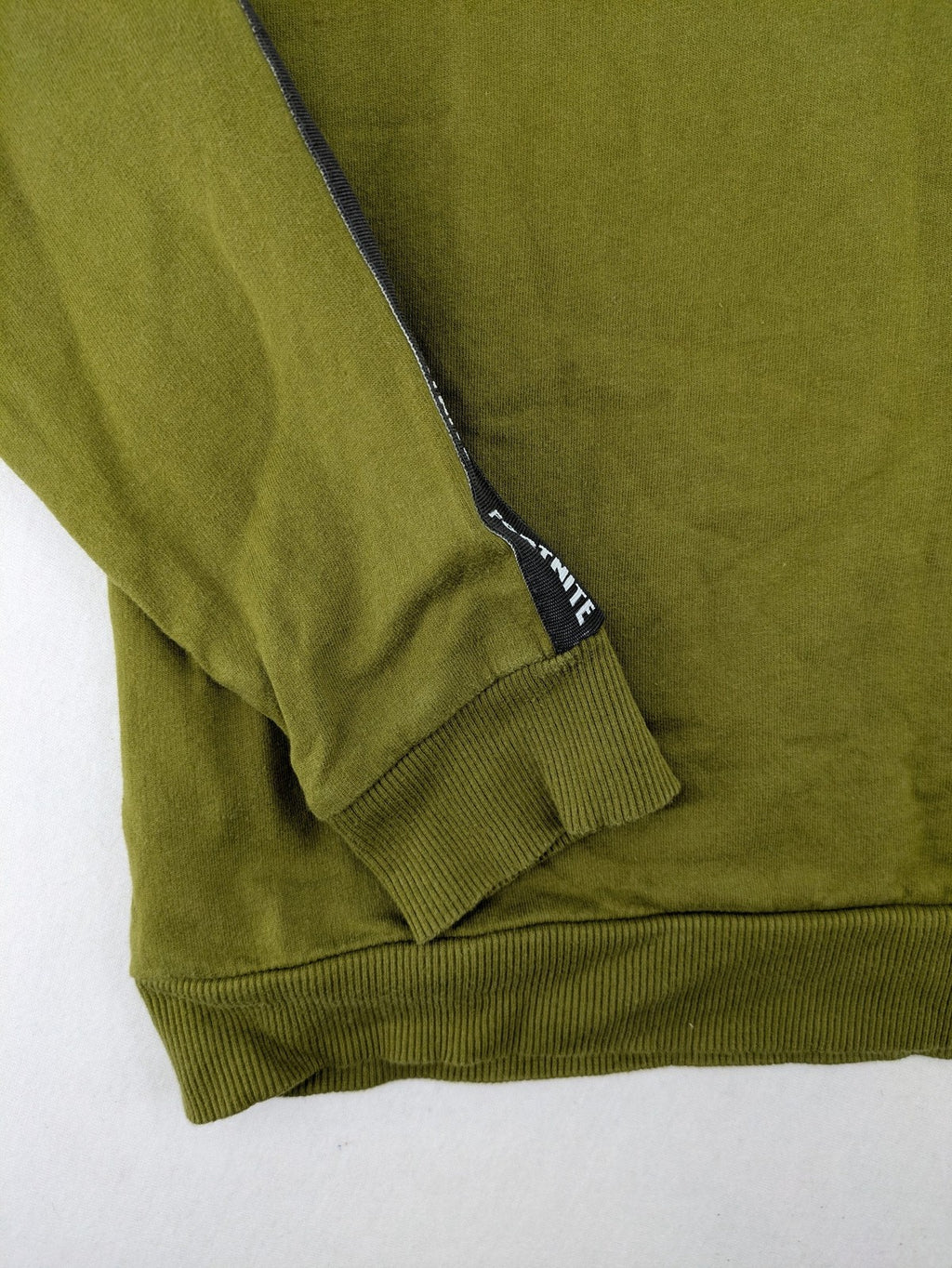 Fortnite green camo hoodie with black logo, contrasting hood, and logo taping on sleeves.