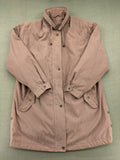 Goldix beige coat with checkered lining and Sympatex waterproof technology.