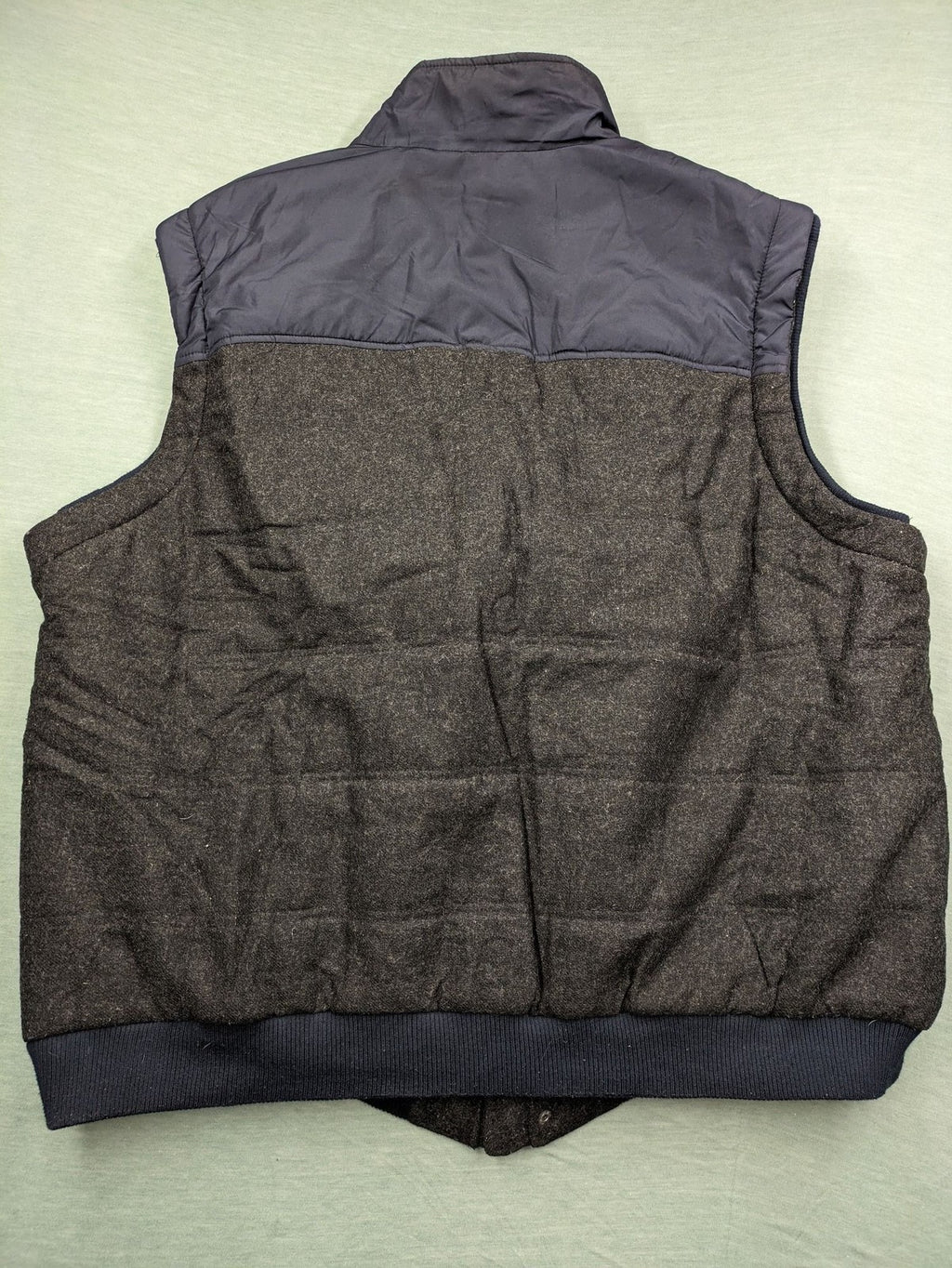 Men Plus grey and navy quilted vest with full zip and snap button placket.