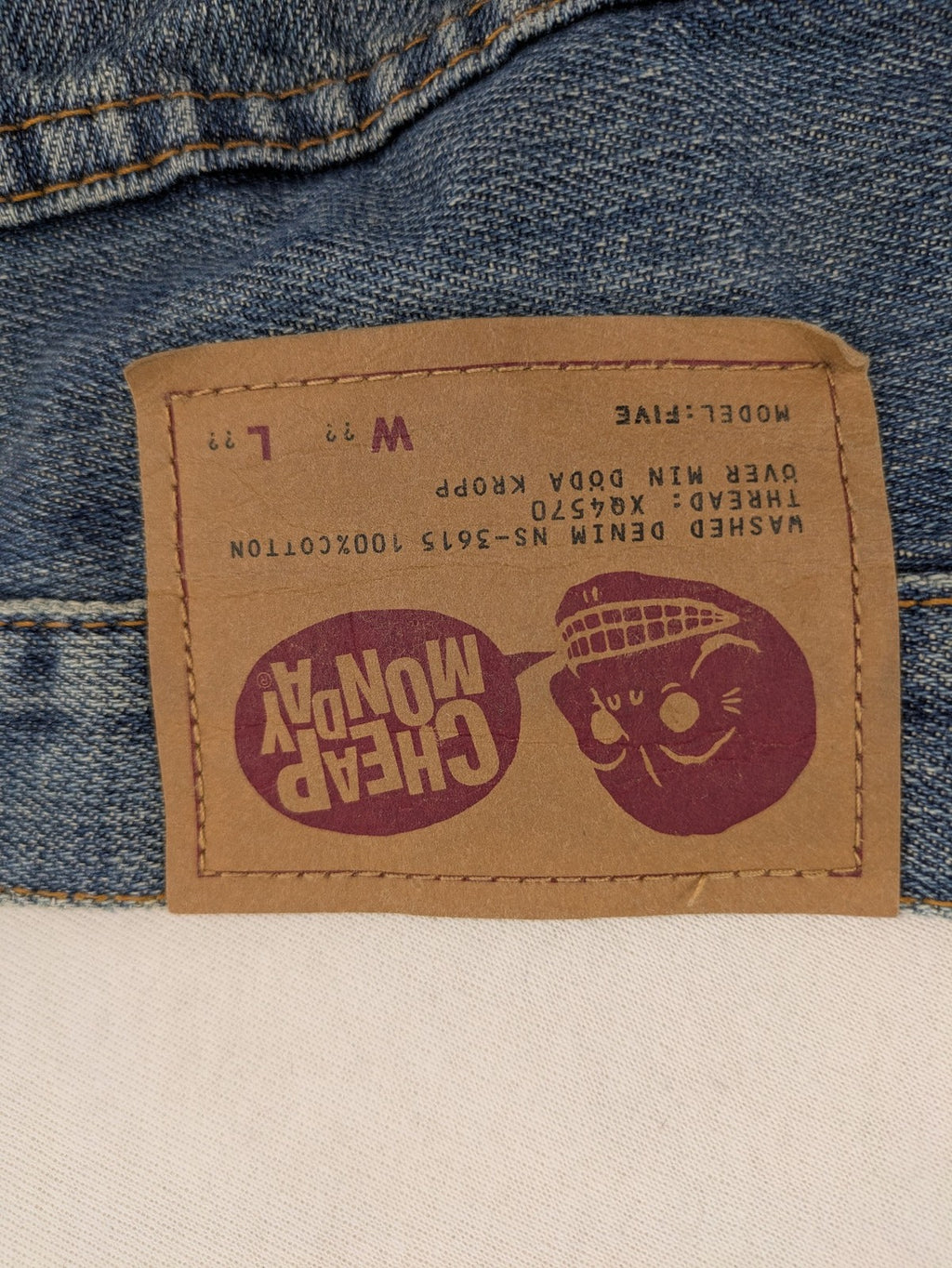 Cheap Monday blue straight jeans with button fly and classic medium wash finish.