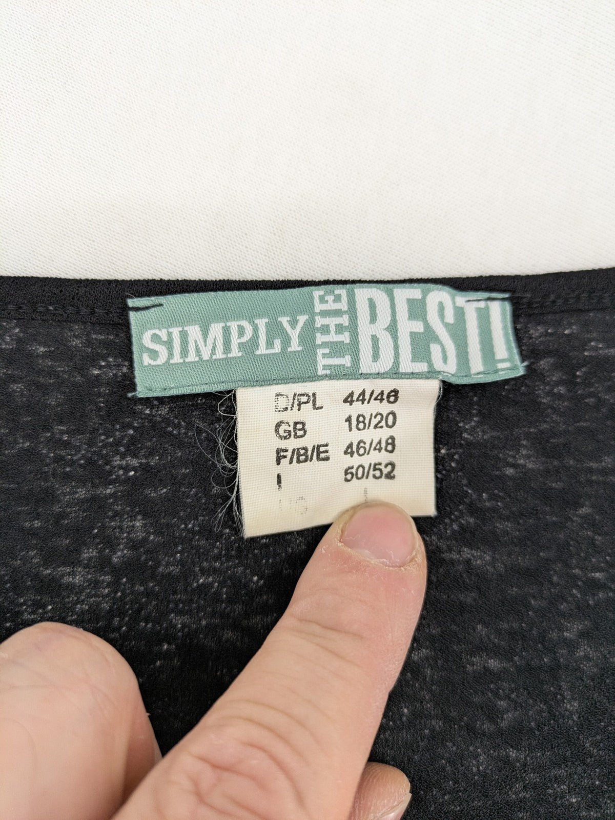 Simply The Best black top with white floral pattern and gathered front detail.