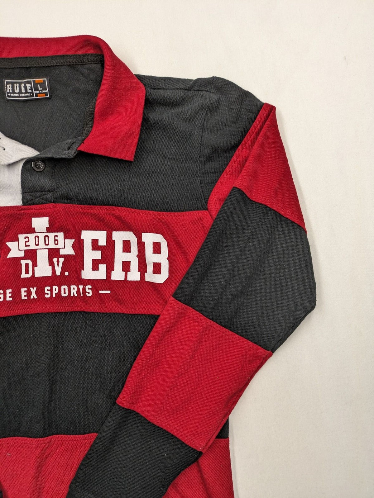 Huge Fashion Exchange rugby polo shirt red and black striped with "SUPERB" graphic.