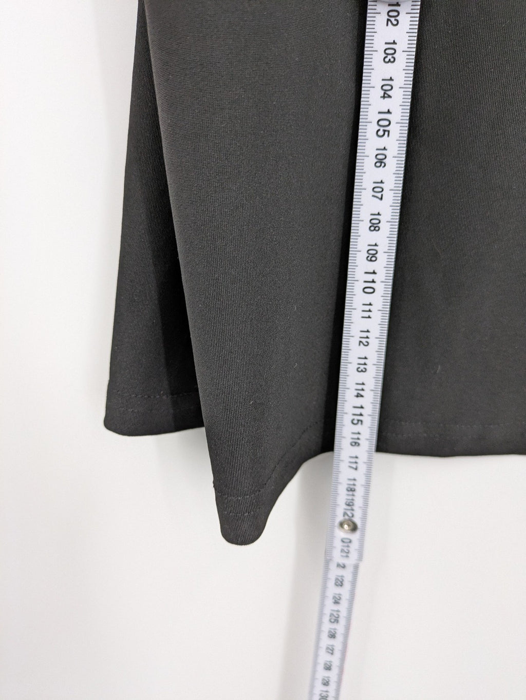 Milano black bodycon T-shirt dress with stylish print and side slit detail.