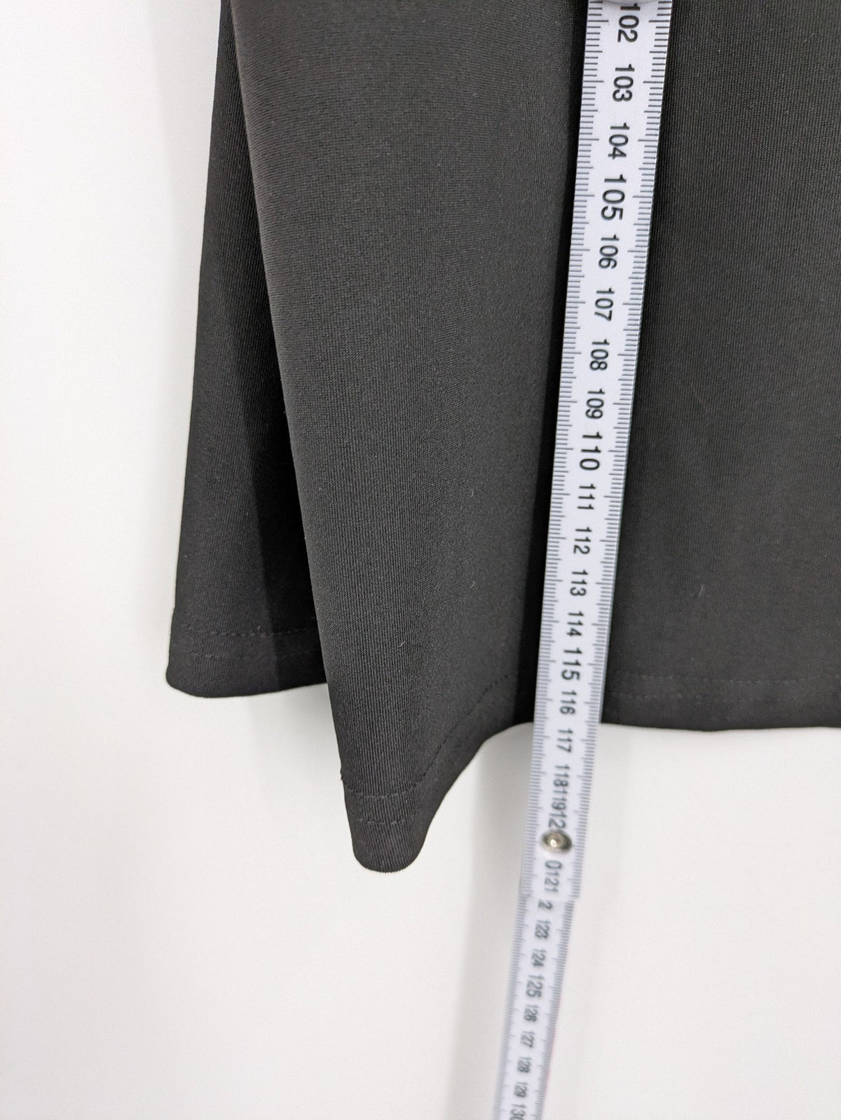 Milano black bodycon T-shirt dress with stylish print and side slit detail.