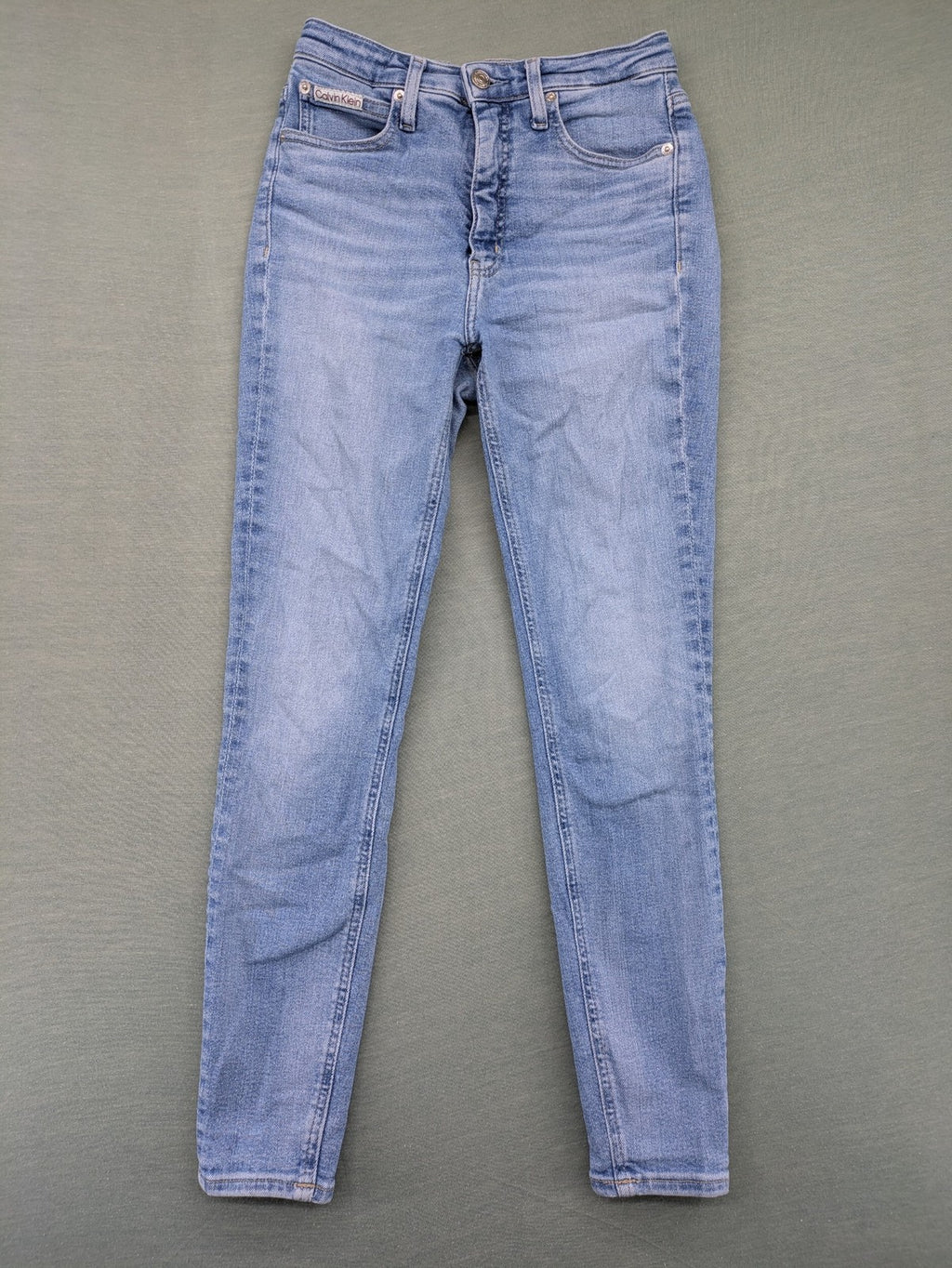 Calvin Klein Jeans blue high rise super skinny ankle jeans with logo patch and stretch material.