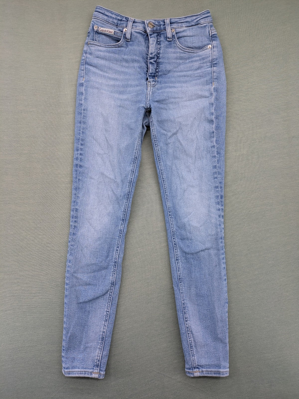 Calvin Klein Jeans blue high rise super skinny ankle jeans with logo patch and stretch material.