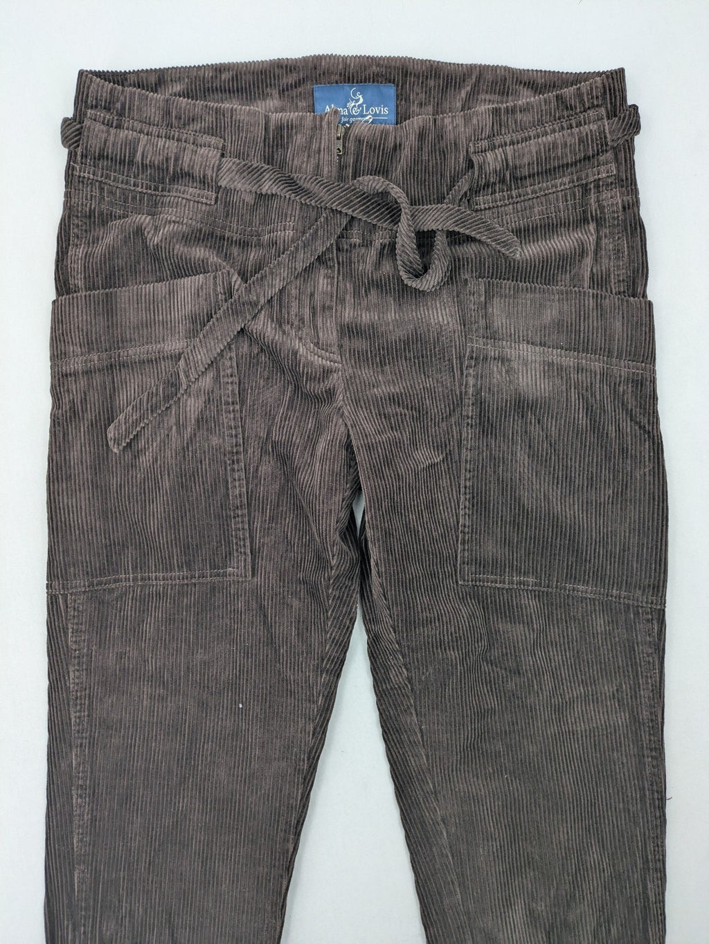 Alma & Lovis brown cord pants paperbag style with belt, made from organic cotton.