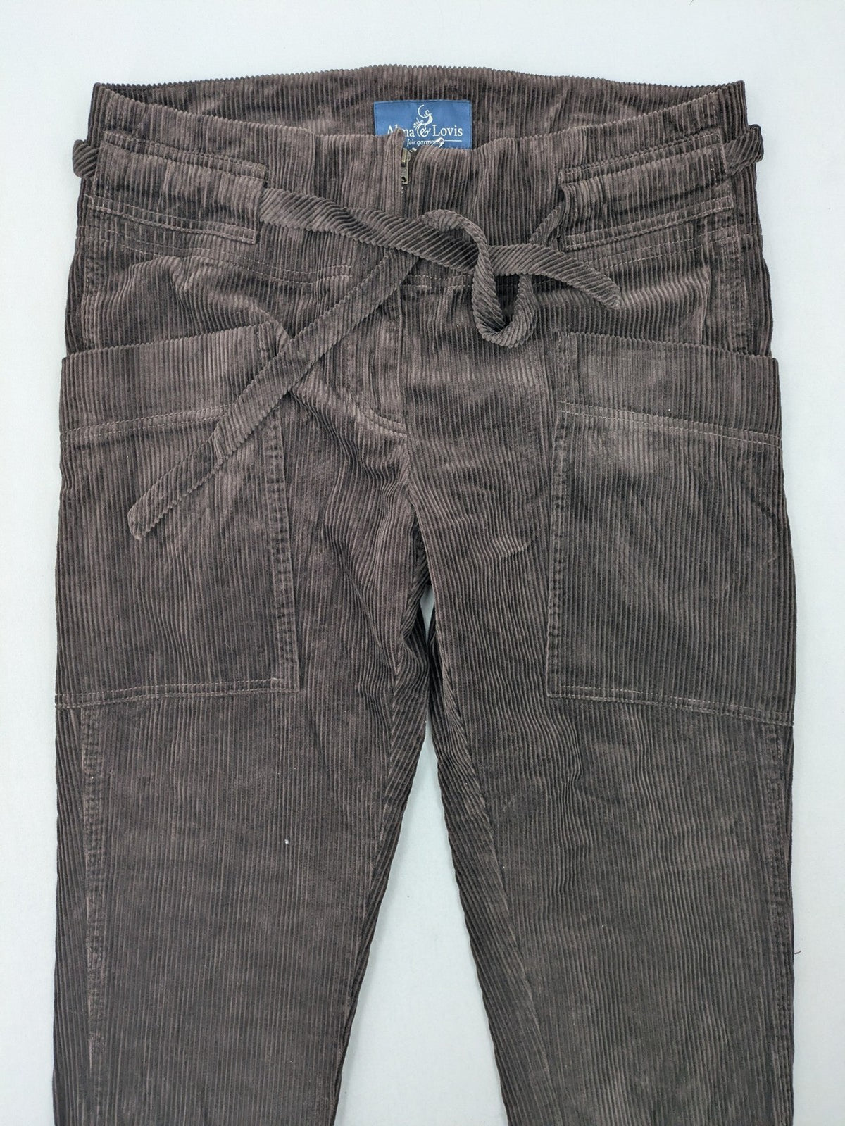 Alma & Lovis brown cord pants paperbag style with belt, made from organic cotton.
