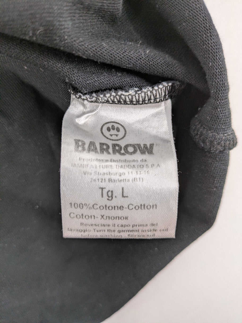 Barrow grey t-shirt with large black and white smiley graphic print and logo patch.