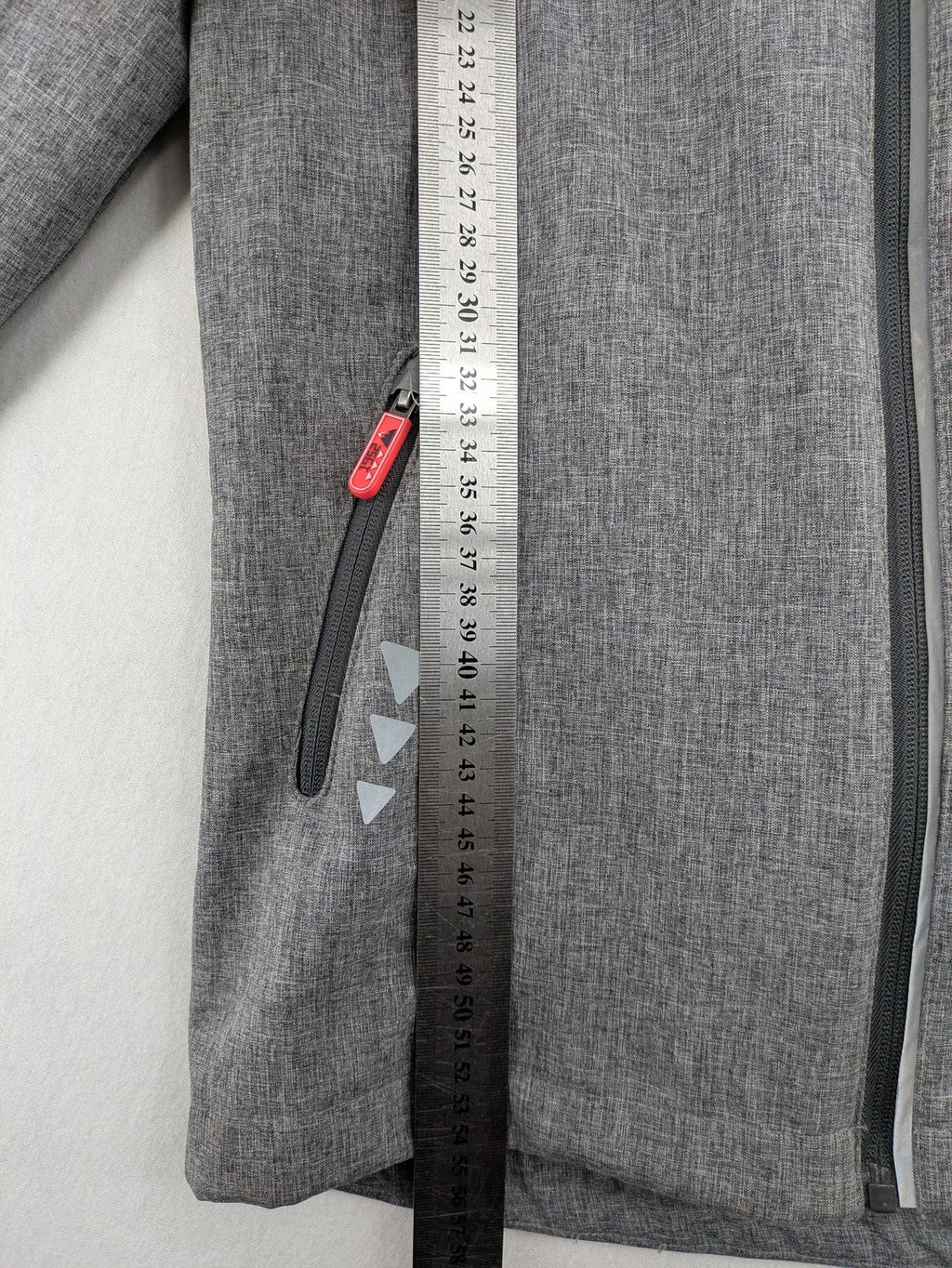 Northville grey and red softshell jacket with hood, fleece lining, and reflective elements.