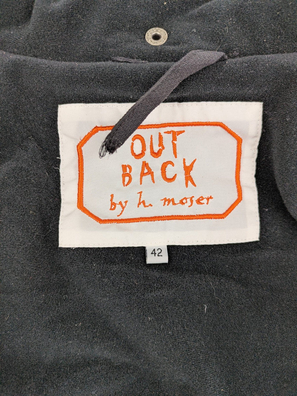 Outback orange outdoor jacket size 42 with reflective accents and mixed color details.