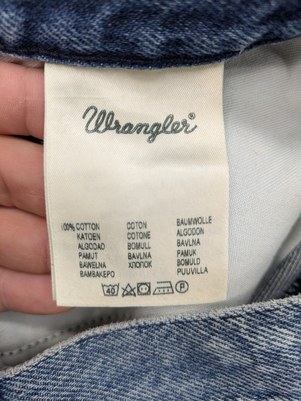 Wrangler blue straight jeans with button fly and classic 5-pocket design.