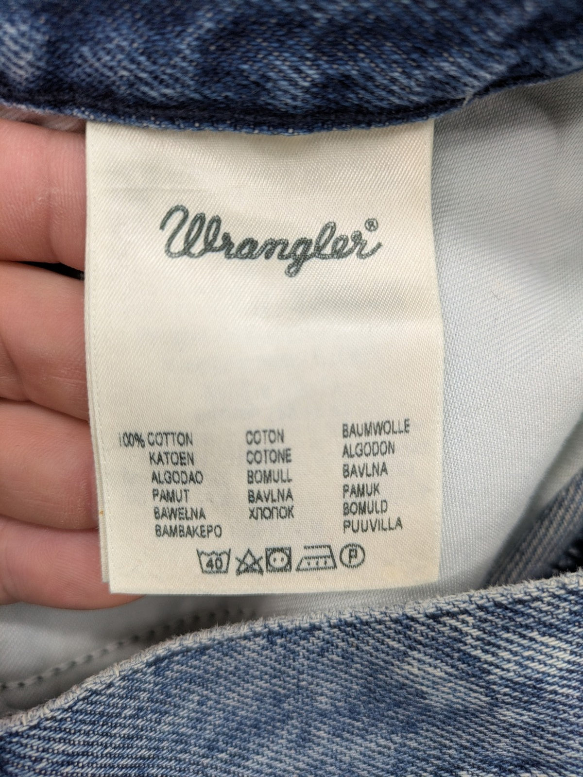Wrangler blue straight jeans with button fly and classic 5-pocket design.