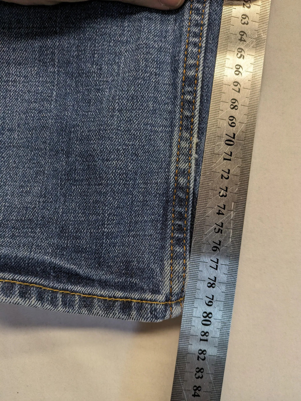 Hollister blue slim fit jeans with distressed detailing and classic button fly.