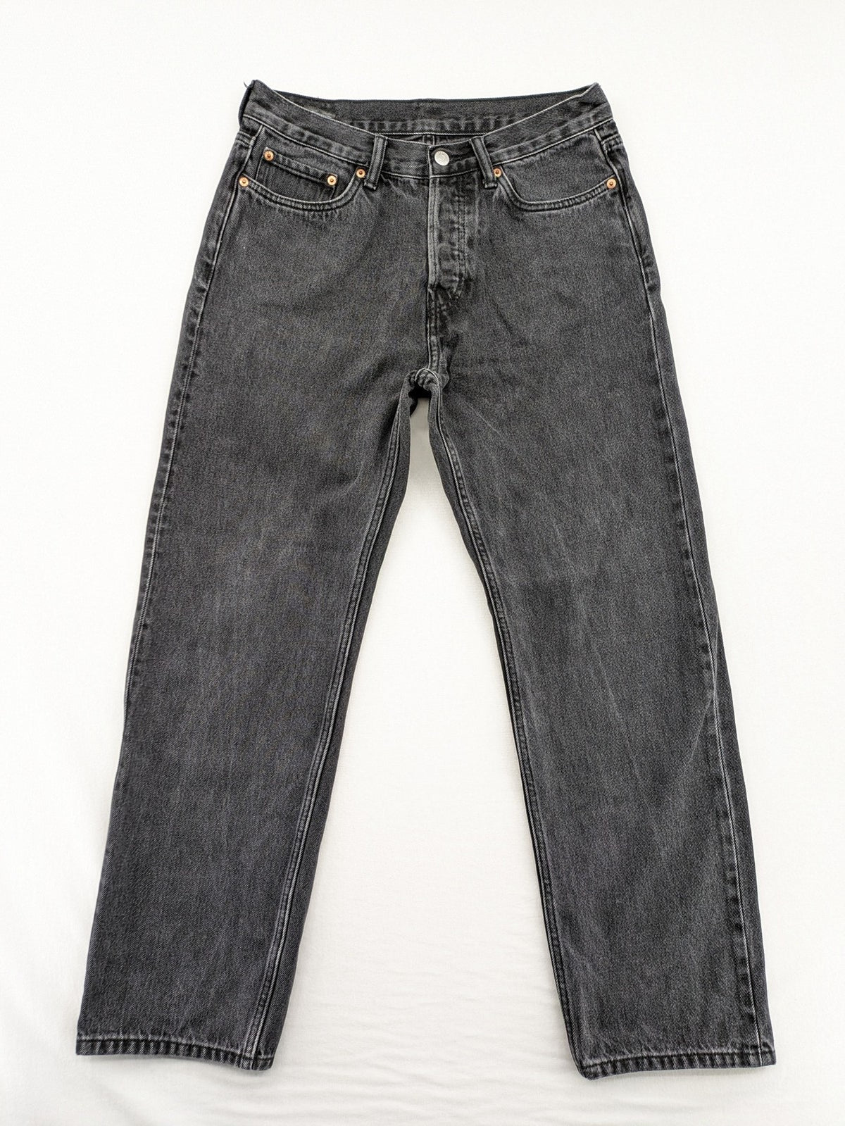 Weekday grey straight jeans with button fly and classic denim design.