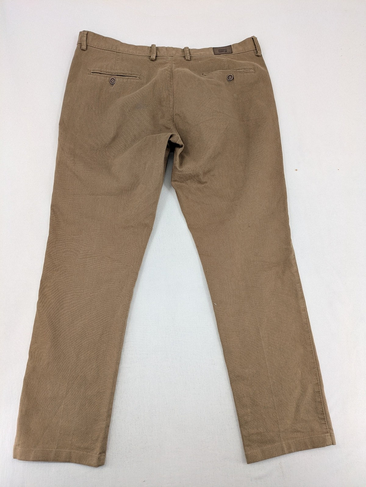 Süvari khaki chino pants flat-front design with patterned waistband detail, cotton blend material.