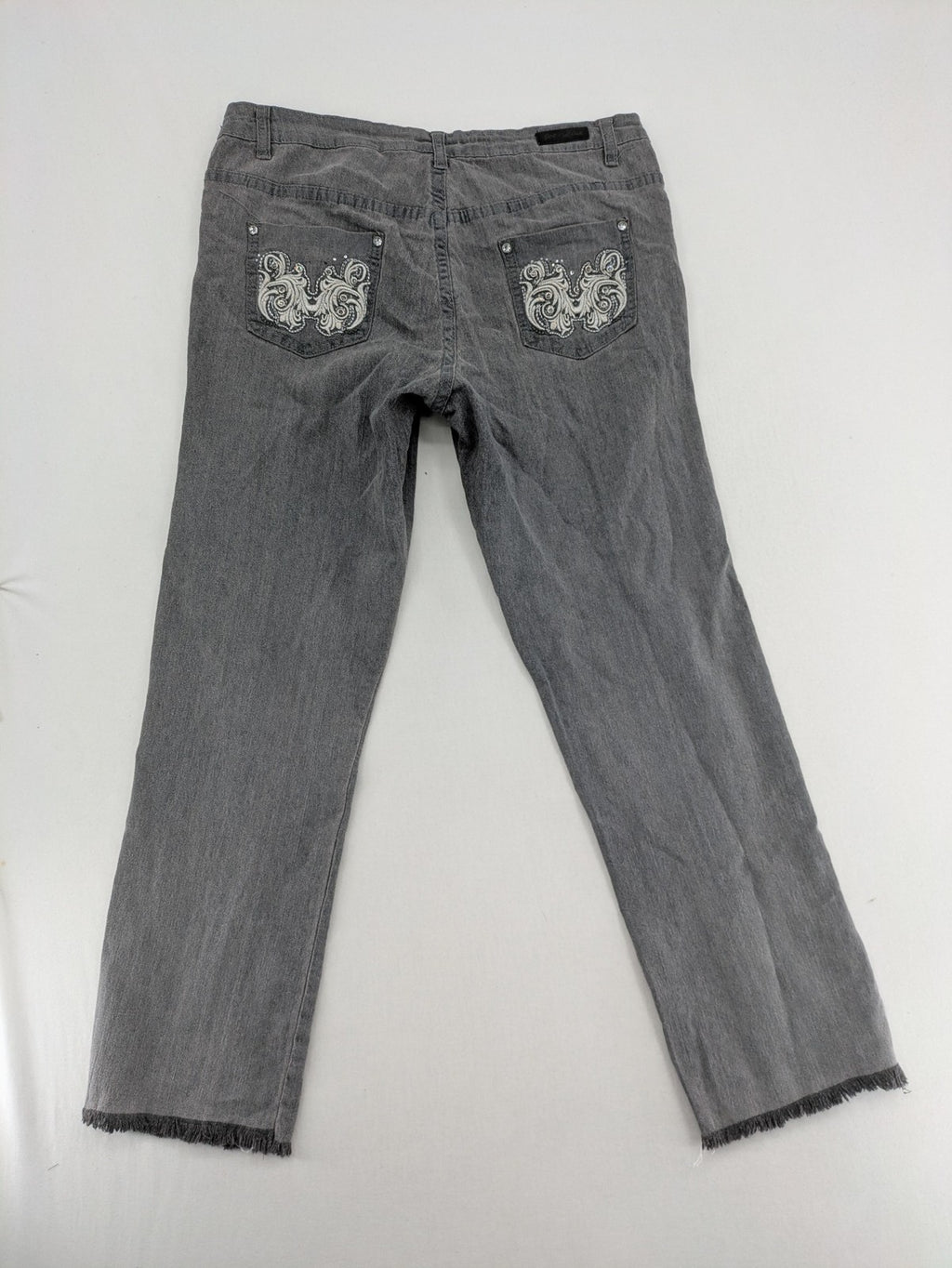 Jet Line grey straight jeans with embellished back pockets and frayed hem details.