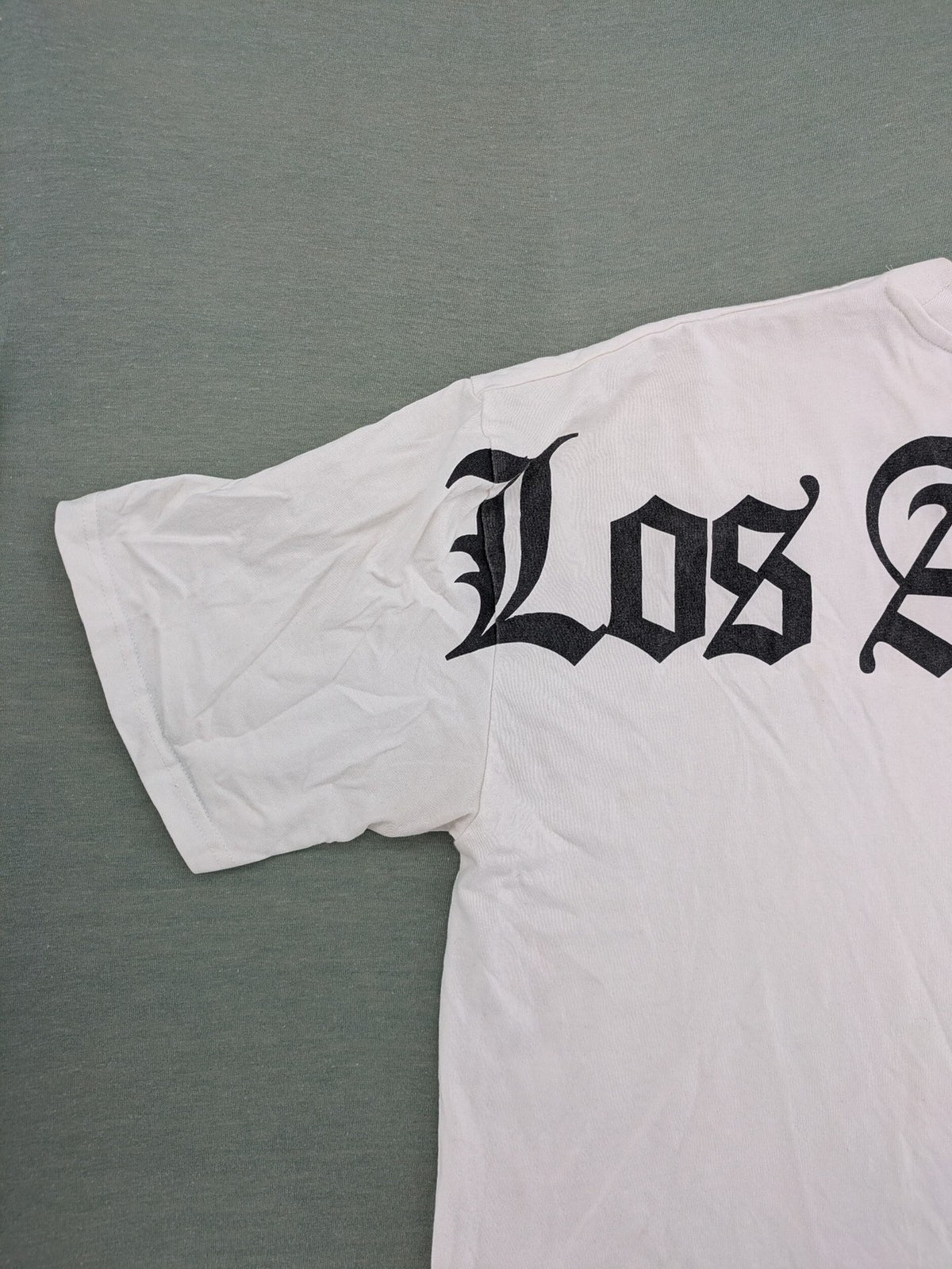 Black Squad black oversized t-shirt with white "Los Angeles" backprint and cotton material.