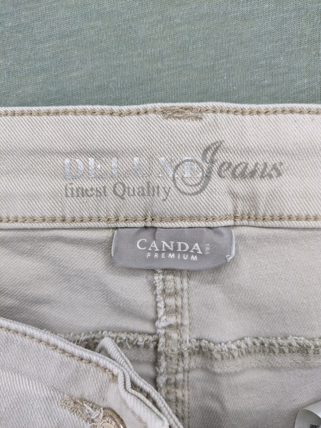 Canda beige straight jeans with strass details and classic five-pocket design.