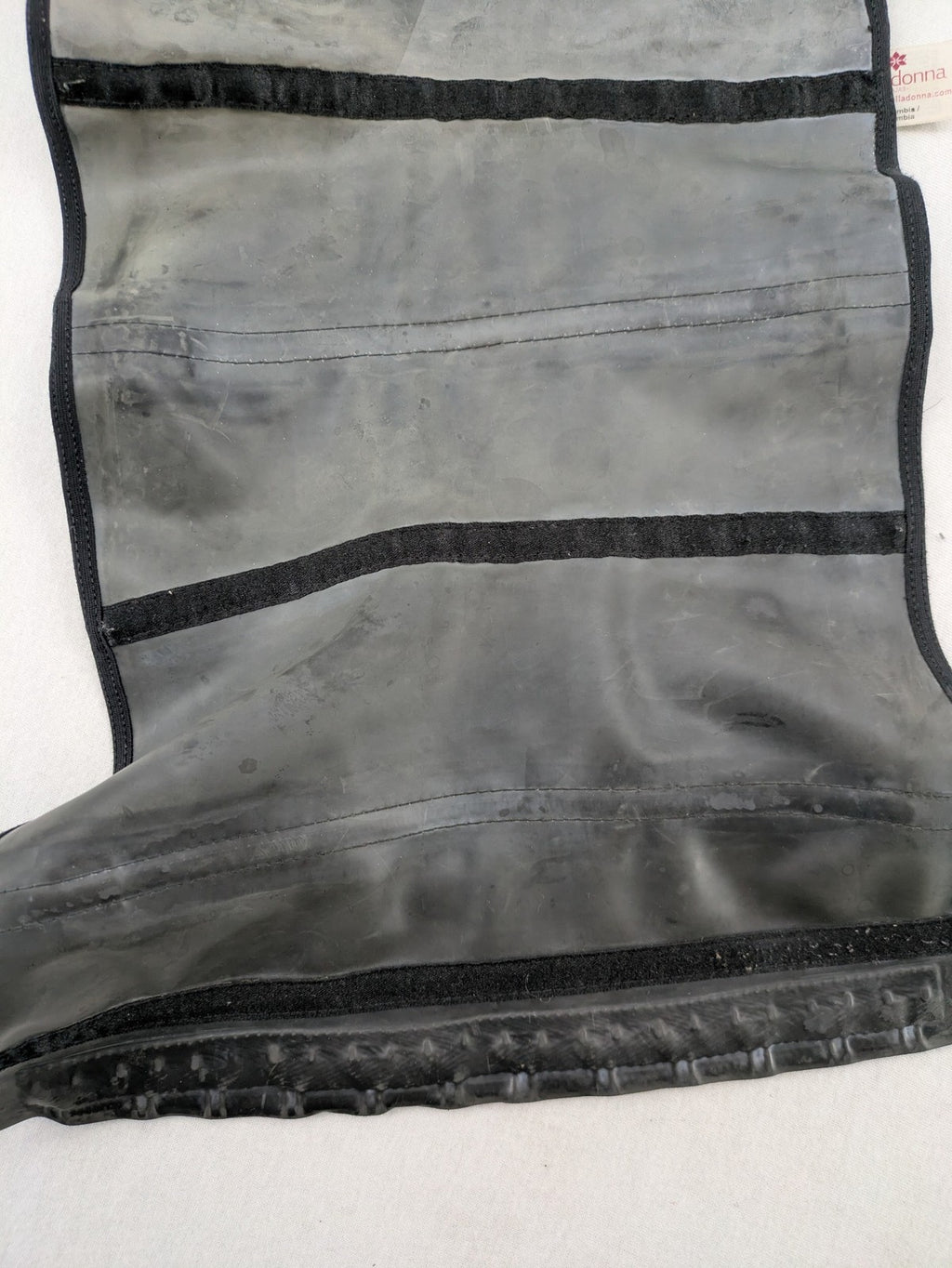 Faja black shapewear body shaper with multiple hook-and-eye closures and latex core.