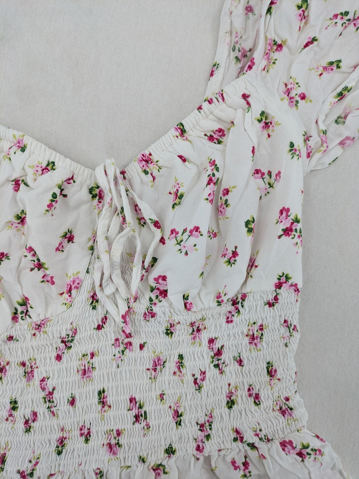 FB Sister floral playsuit white with pink flowers, smocked bodice, lightweight viscose material.
