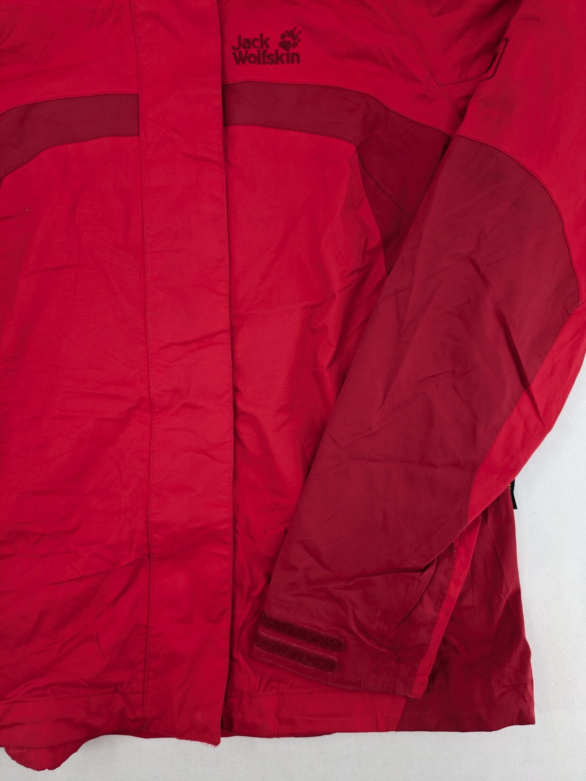 Jack Wolfskin red outdoor jacket with adjustable hood and Texapore waterproof technology