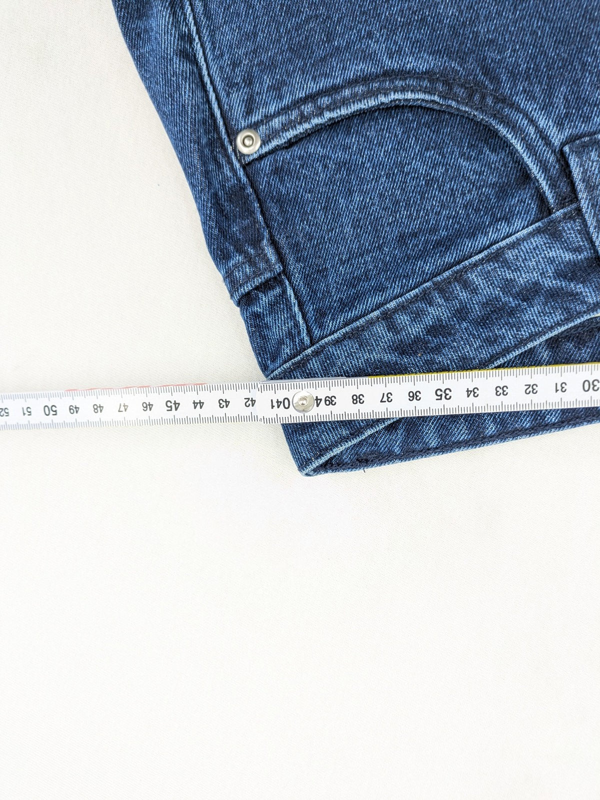 Tchibo blue straight jeans with five-pocket design and wide leg cut in durable cotton.