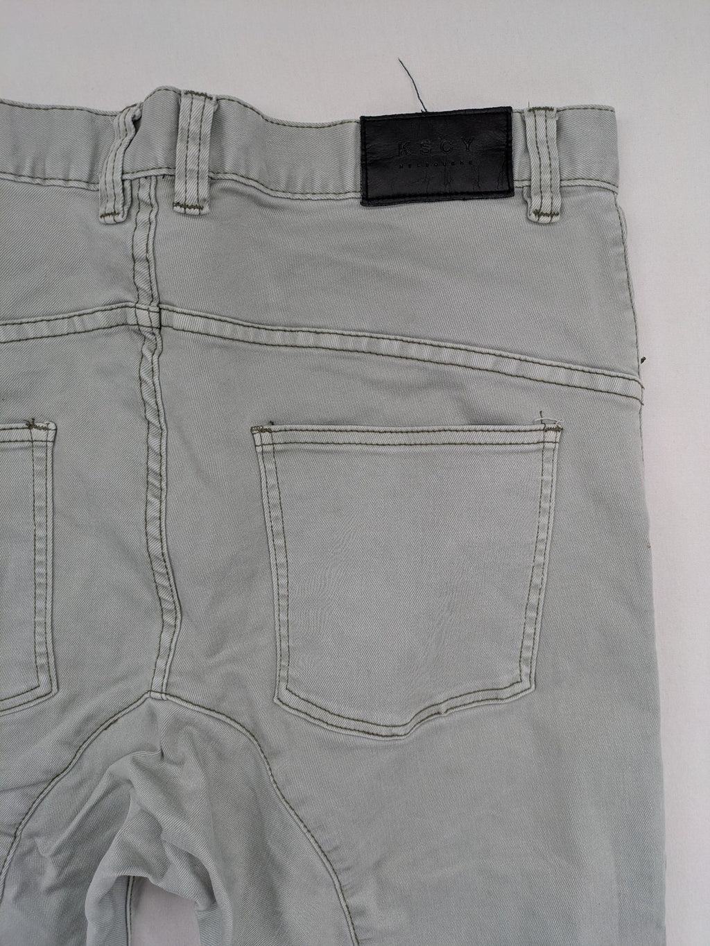 KSCY grey straight jeans with distressed details and ribbed biker inserts.