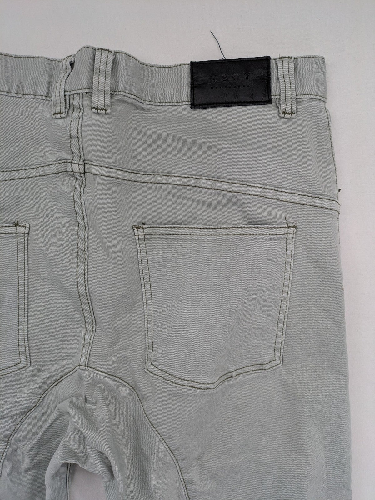 KSCY grey straight jeans with distressed details and ribbed biker inserts.