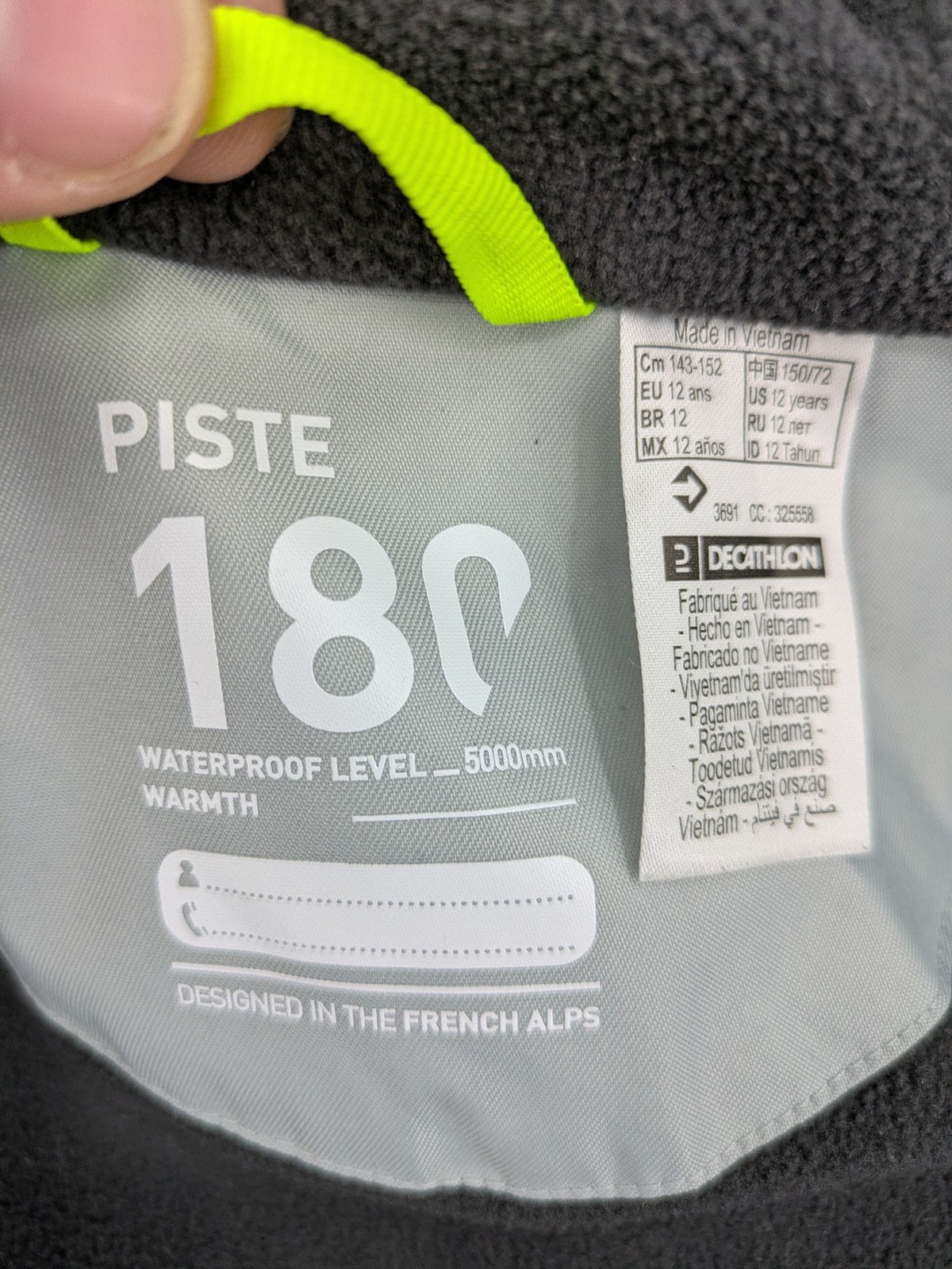 Wedze ski coat grey and black colorblock design with neon accents and fleece lining.