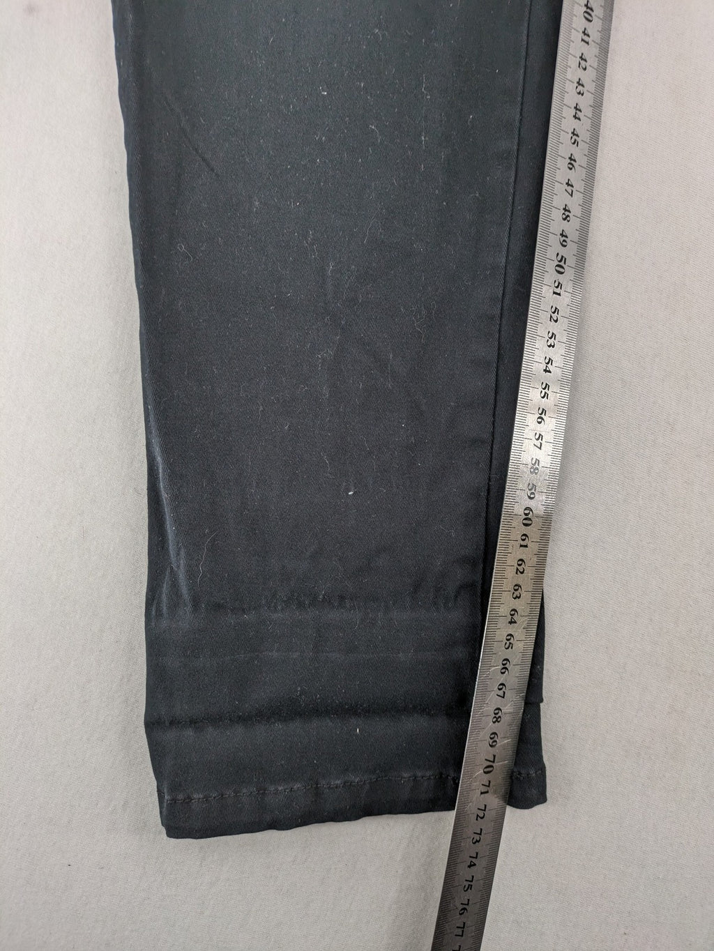 REI grey pants asymmetrical design with diagonal zipper and button placket, cotton blend.