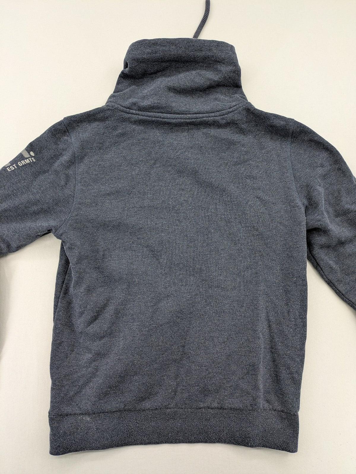 s.Oliver green turtle neck sweatshirt with adjustable drawstrings and graphic detail on sleeve