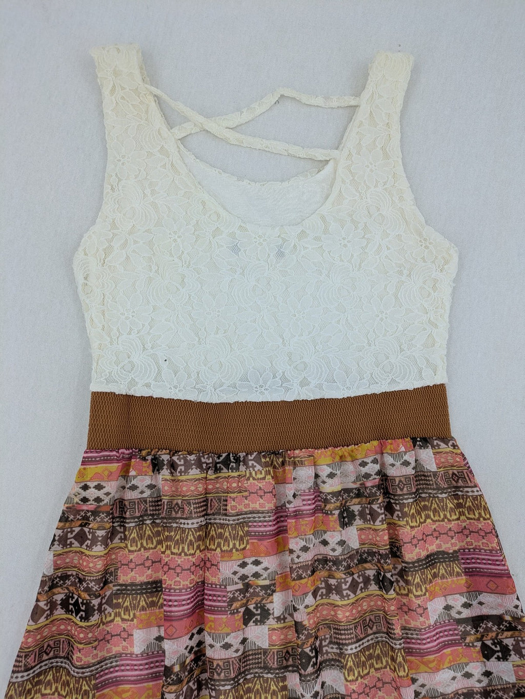 Boho multi summer dress white lace bodice with crossed straps and high-low hem.