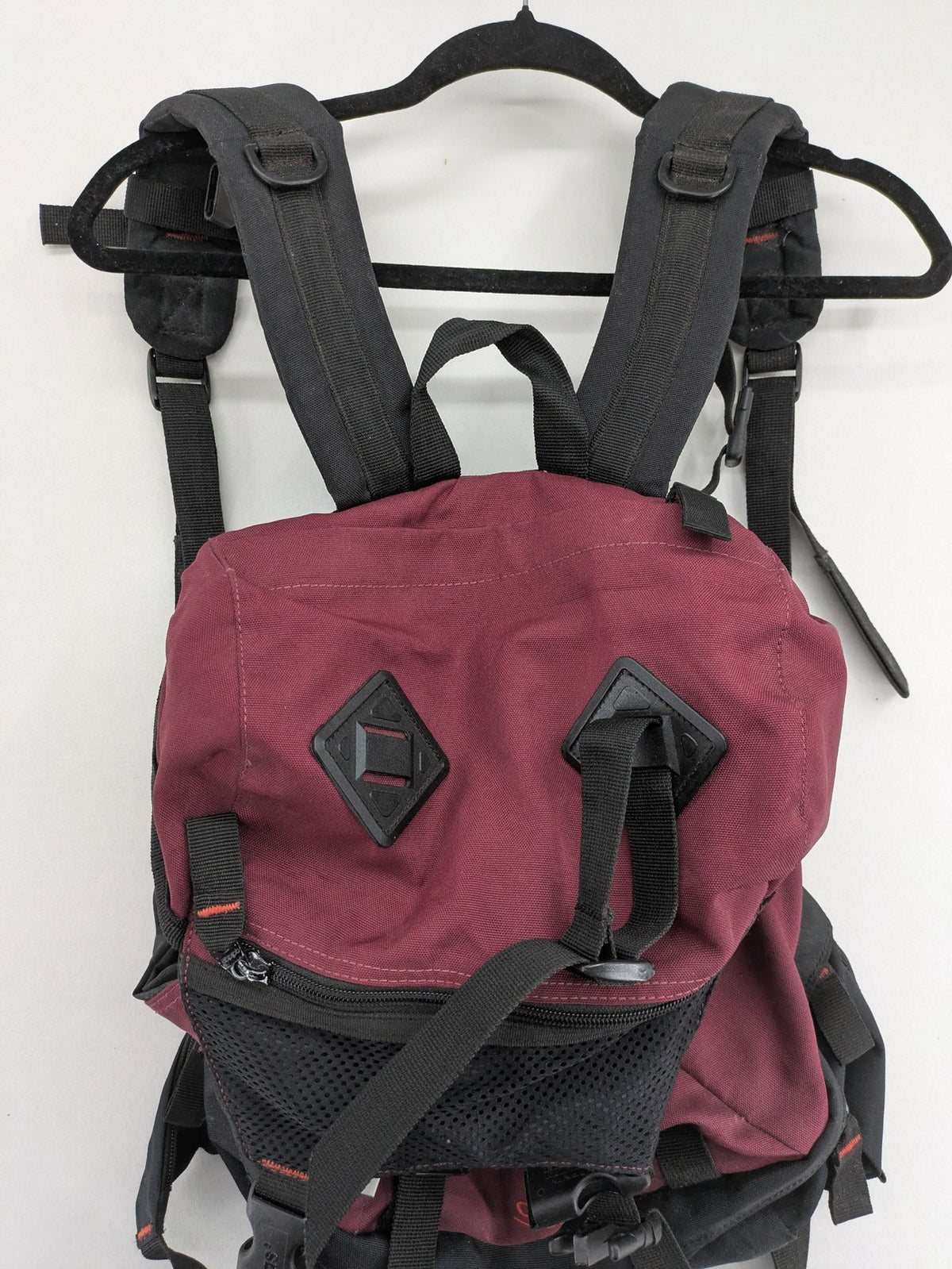 Adidas burgundy vintage rucksack with logo, Teflon fabric, and drawstring closure.