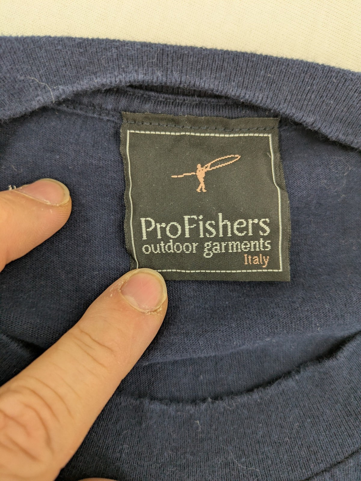 ProFishers navy t-shirt with compass print and large fish graphic on back.