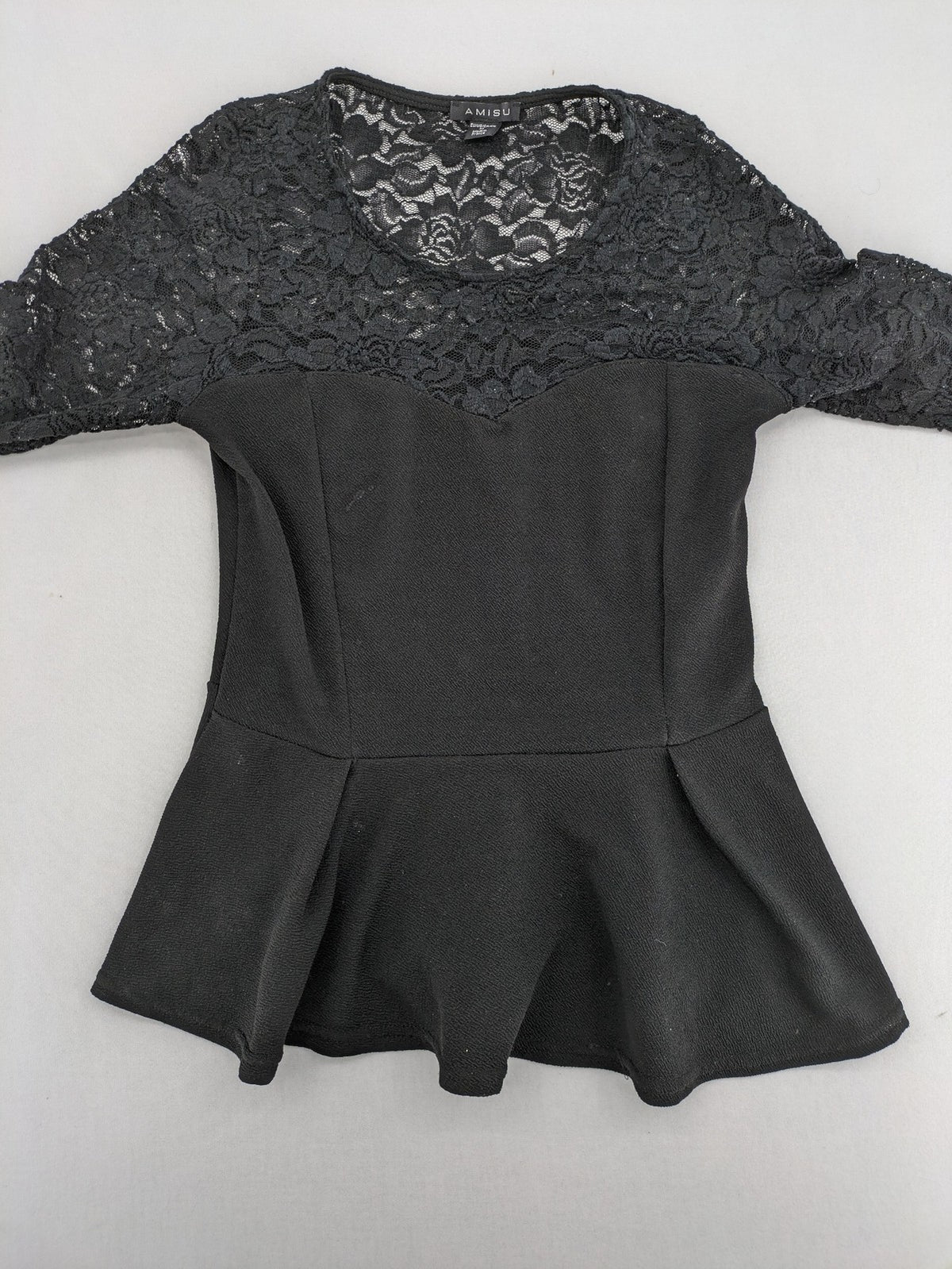 Amisu black peplum top with floral lace sleeves and delicate lace trim.