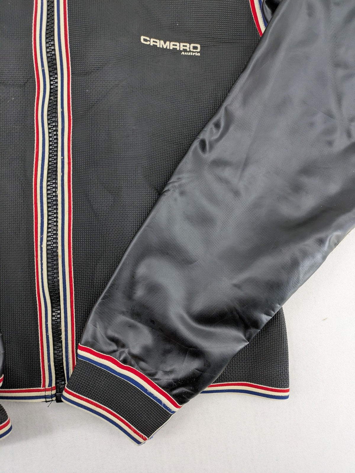 Camaro vintage jacket multi-colour with striped accents and structured body.