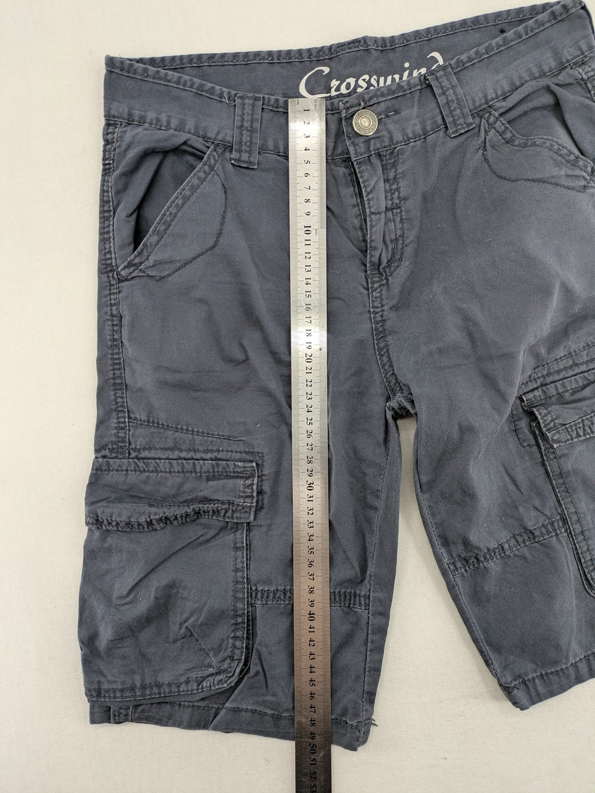 Crosswind grey cargo shorts with multiple pockets and durable cotton material.
