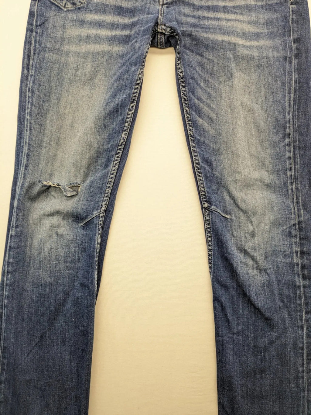 WAM Denim blue straight jeans with distressed details and button fly.