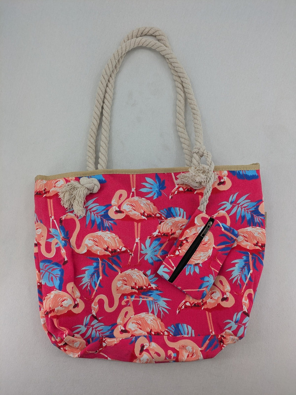 Flamingo pink shopping tote with vibrant tropical flamingo and palm leaf pattern.