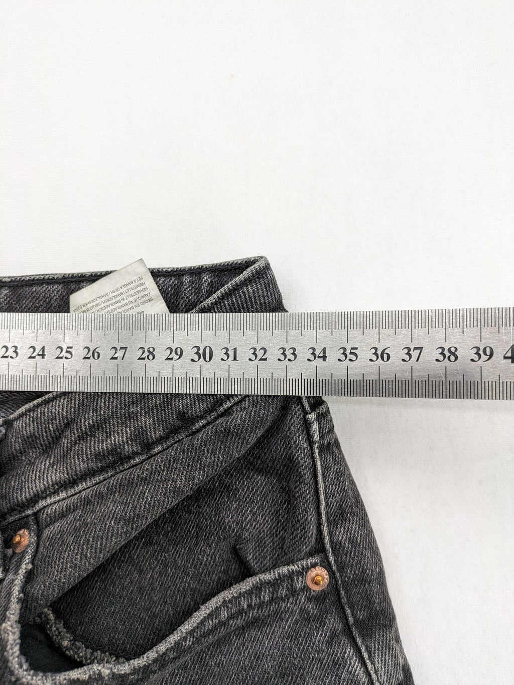 Bershka black mom jeans high-waist straight leg washed denim with classic five-pocket design.