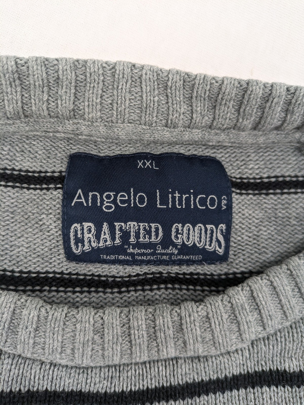 Angelo Litrico grey and black striped knit jumper, round neck, soft material.