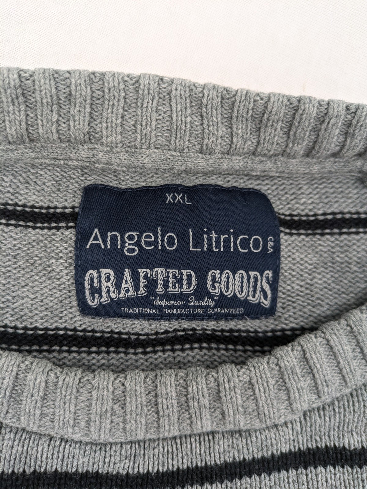 Angelo Litrico grey and black striped knit jumper, round neck, soft material.
