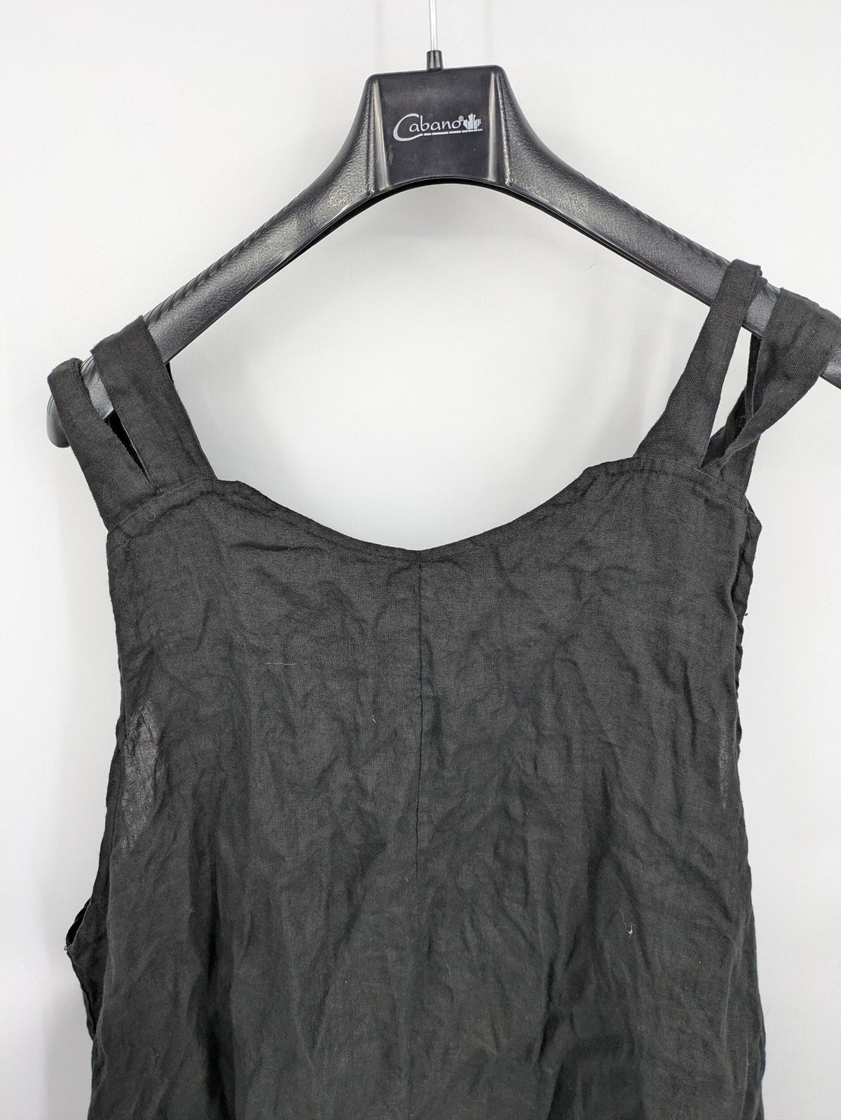 Lagenlook black linen bridal party dress asymmetrical cut with checkered hem and diagonal zipper.