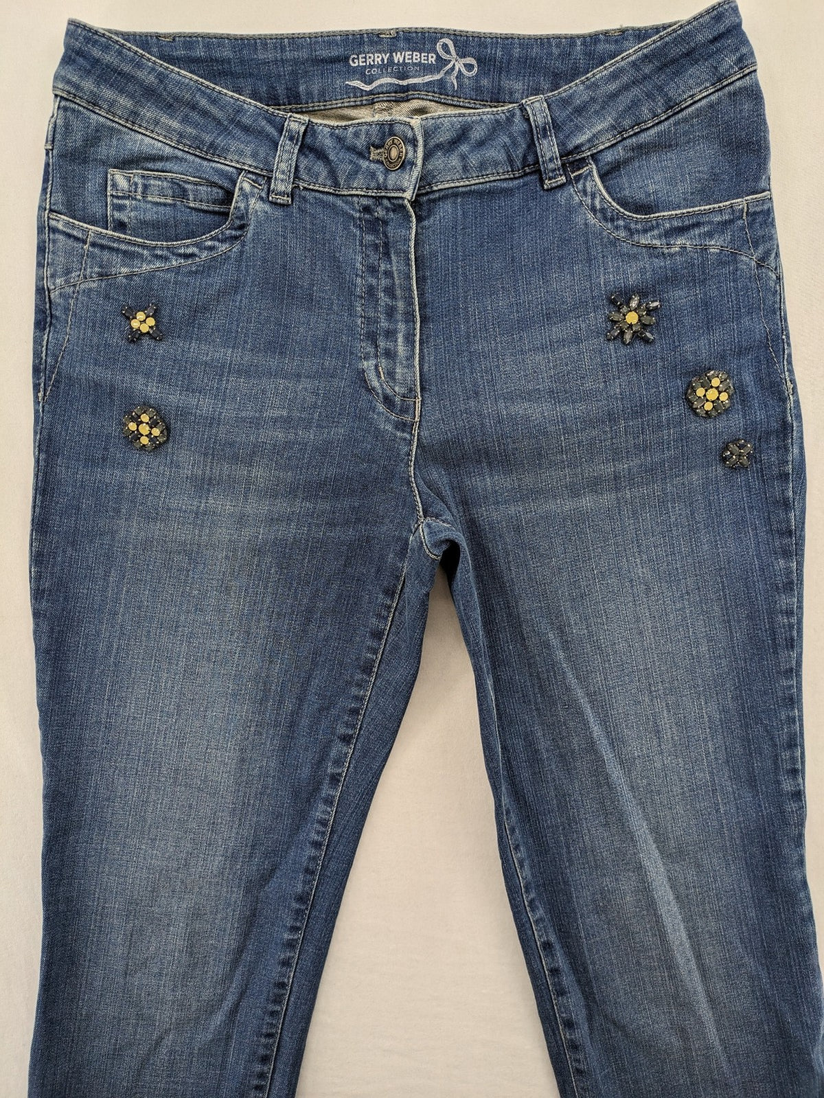 Gerry Weber blue straight jeans with decorative rhinestone appliqués and stretch denim material.