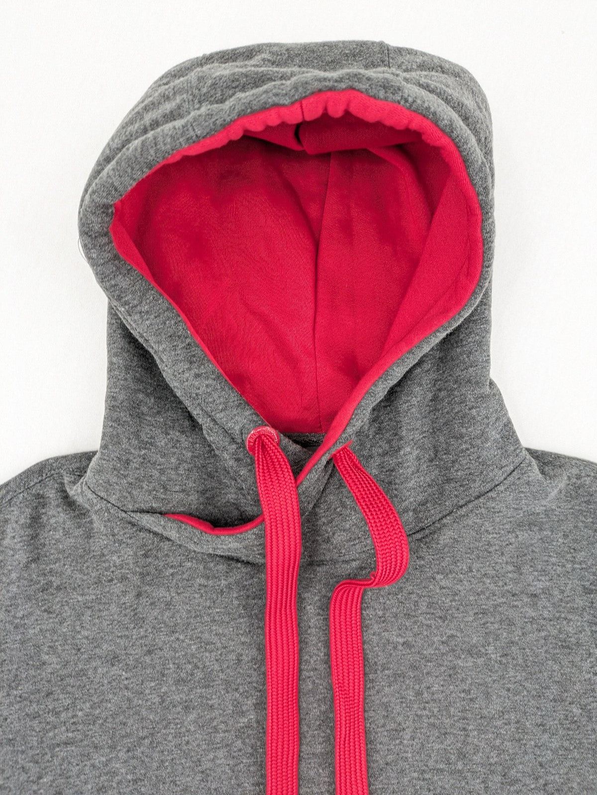 Bolf grey hoodie with pink contrast hood, kangaroo pocket, and ribbed cuffs.