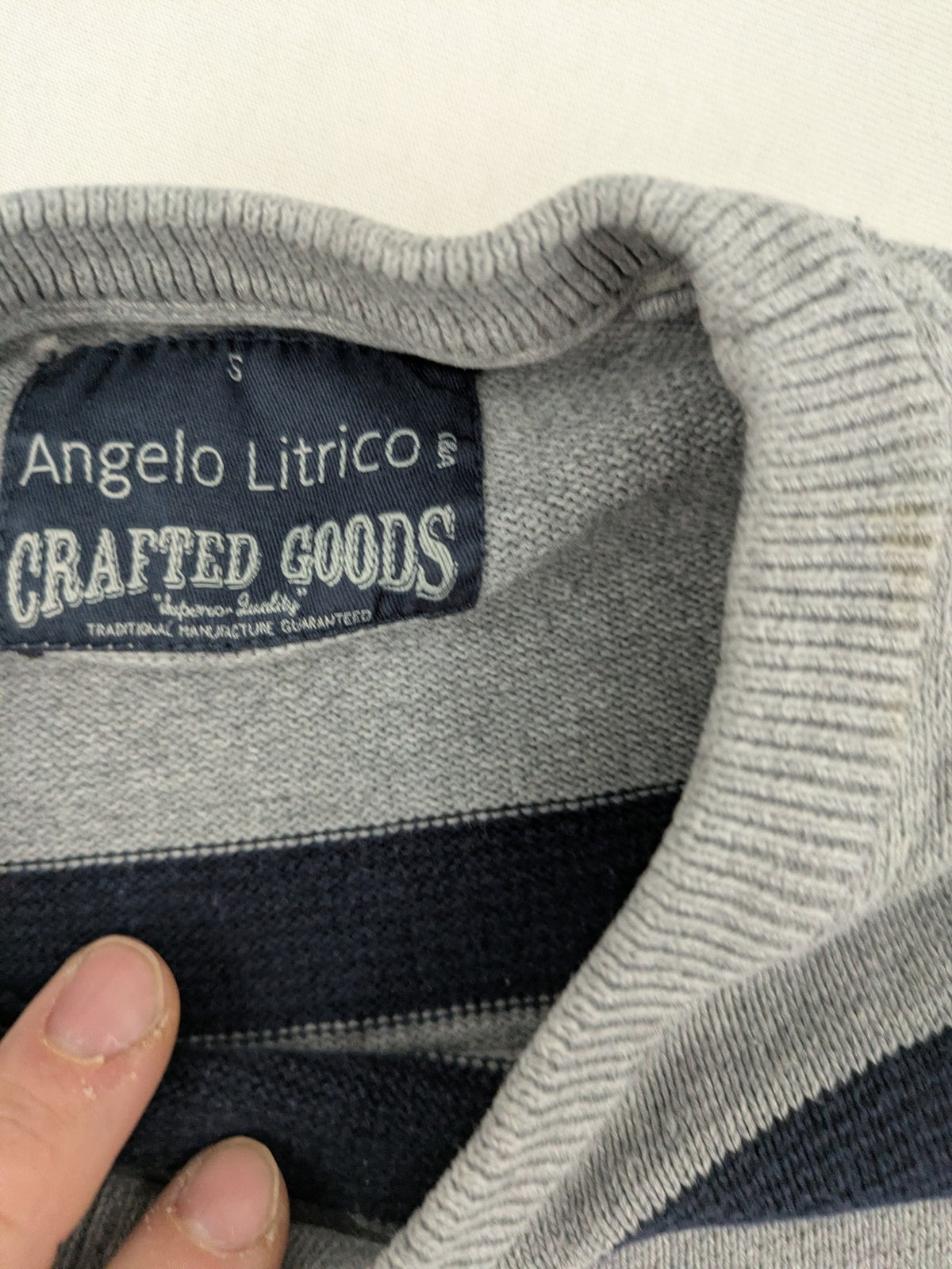 Angelo Litrico navy knit jumper striped pattern in blue, grey, and white, cotton material.