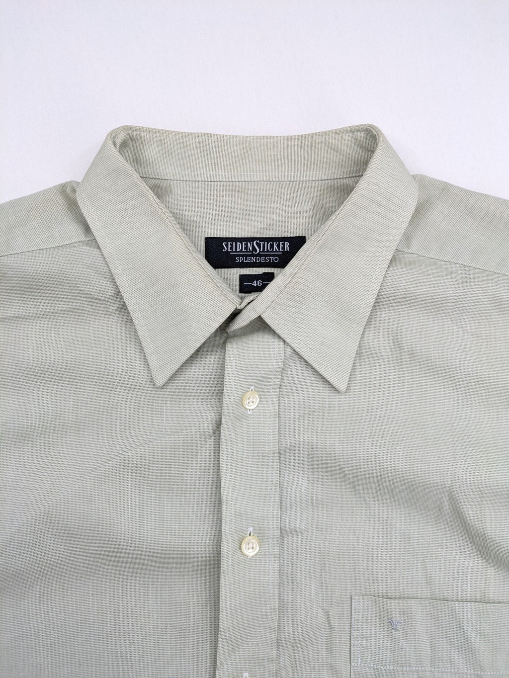 Seidensticker grey button-up shirt with subtle pattern and embroidered logo on pocket.