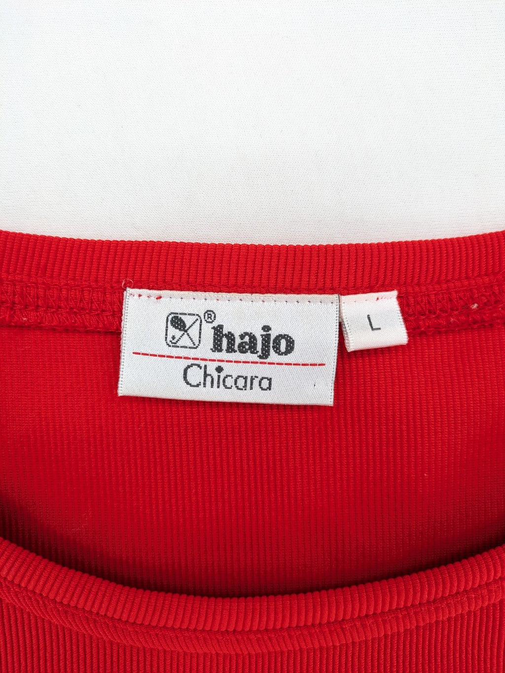 Hajo red t-shirt with ribbed texture and rhinestone Y-logo on chest.